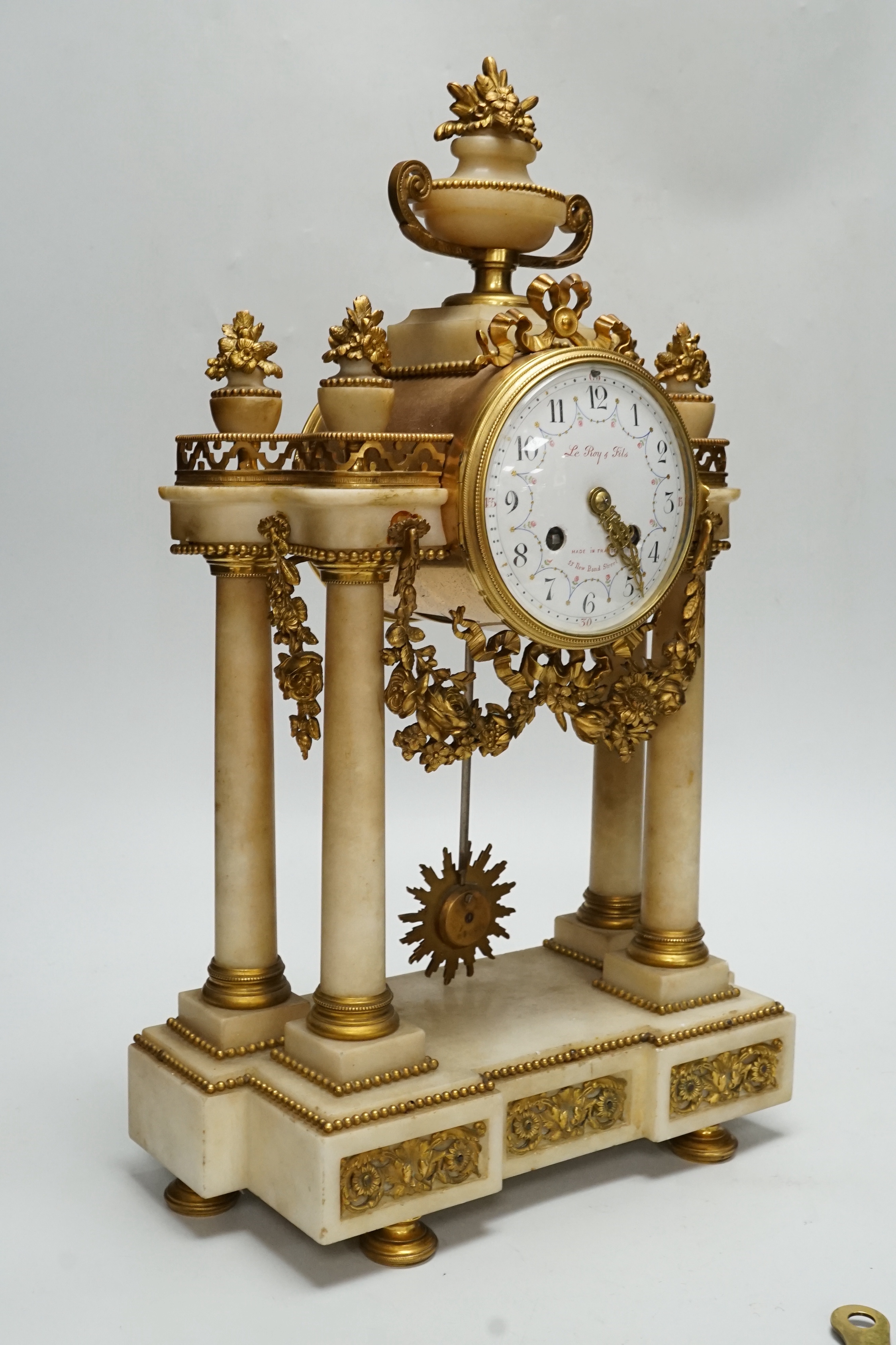 A late 19th century French alabaster and ormolu mounted mantel clock by Le Roy & Fils, key and pendulum, 46cm, NB: From the Estate of Rt Hon Lord Lawson of Blaby